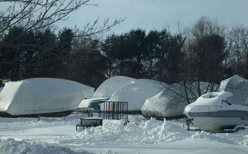 boats covered up in the winter